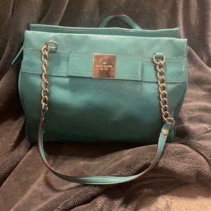 This is practically brand new. Used twice it’s a beautiful teal Kate Spade bag.